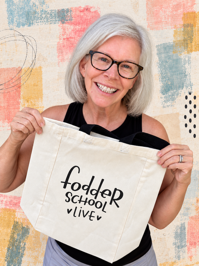Heather Kojan smiling and holding a Fodder School Live tote bag
